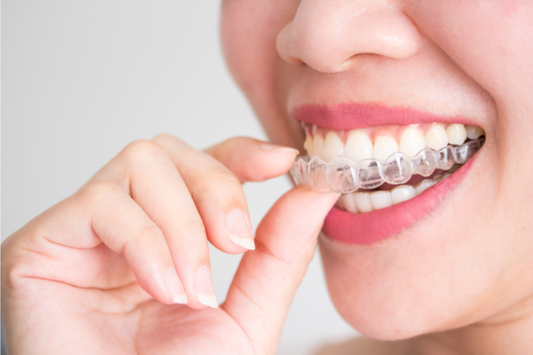 A girl is wearing invisible braces