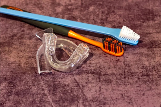 Image of a mouth guard and toothbrush