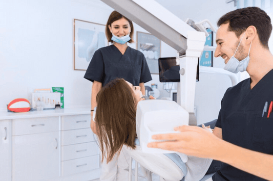 Female patient undergoing her treatment discussion with Dental Specialists