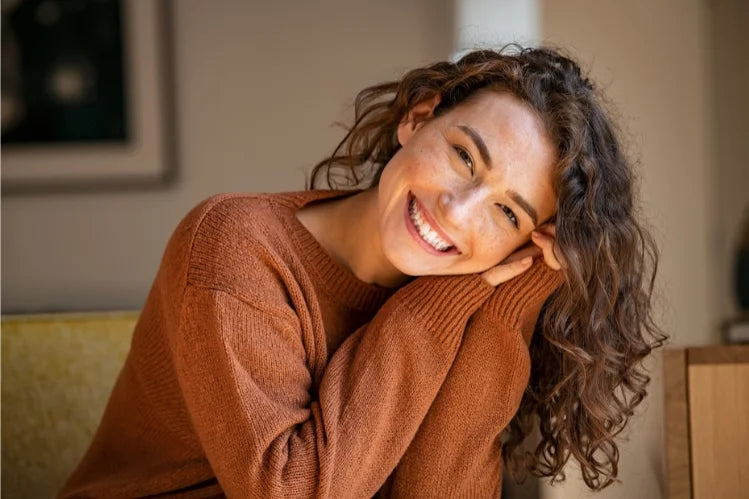 A female smiling with straight teeth