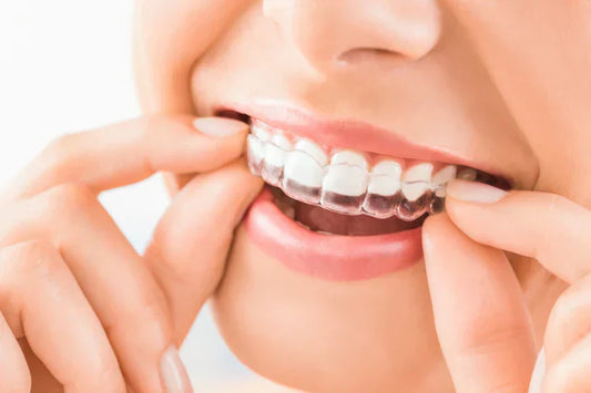 A girl is wearing transparent braces
