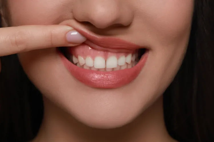  A girl showing her healthy gums.