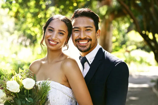  A bride and groom smiling for a perfect wedding picture.