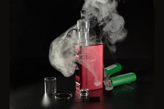A red Vape with smoke on a black background 