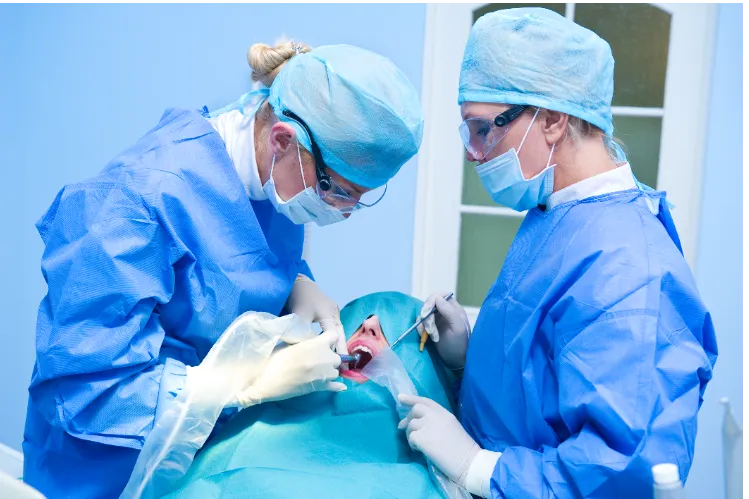 Doctors performing Orthognathic Surgery in the operating room