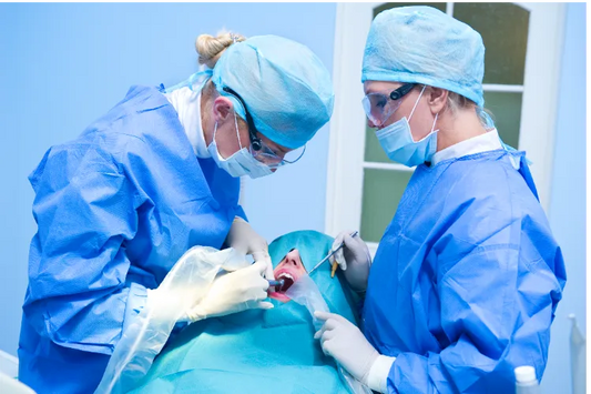 Doctors performing Orthognathic Surgery in the operating room